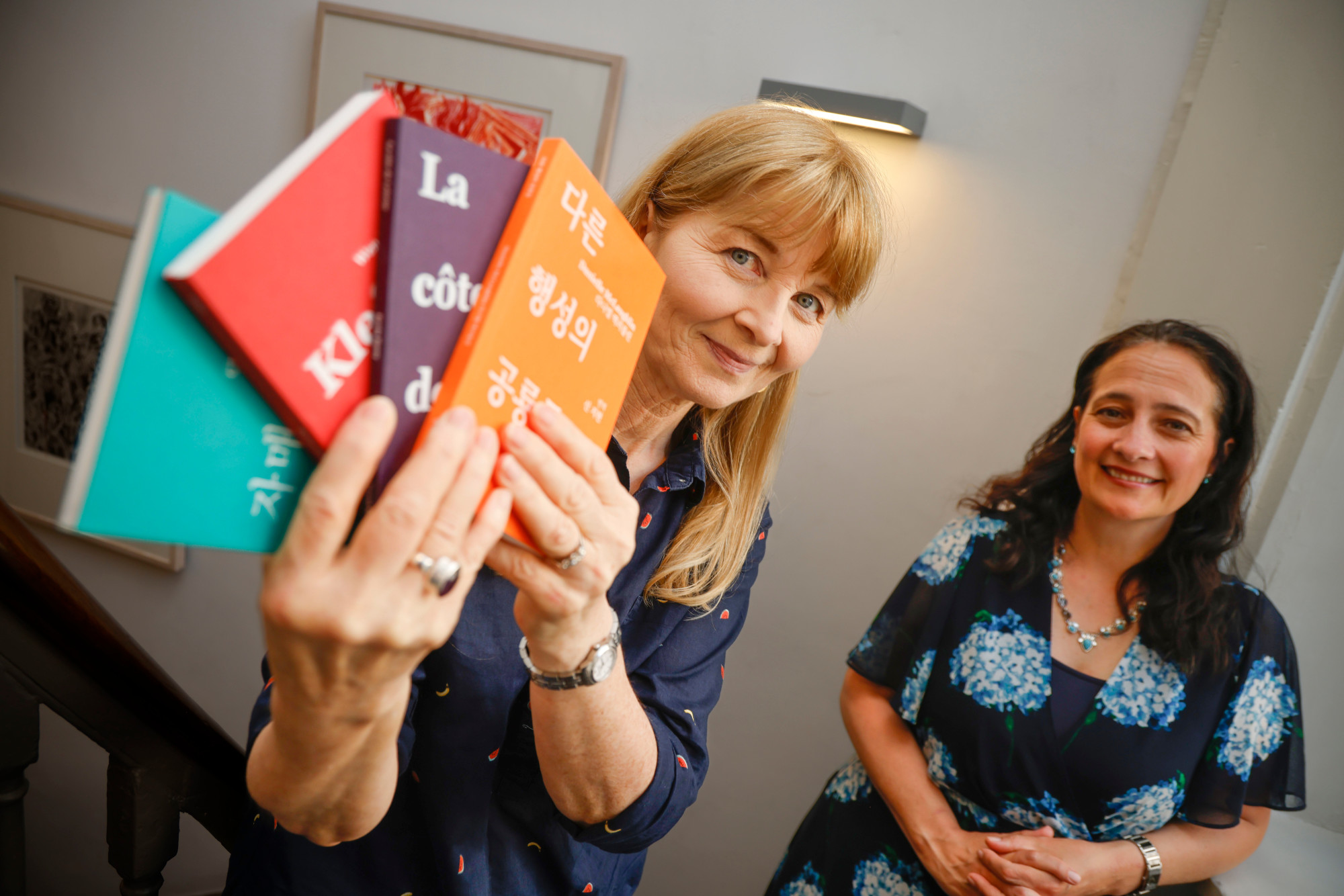 Writer Mary Costello, left, holds copies of Seoda; Minister Catherine Martin, TD, is on the right.